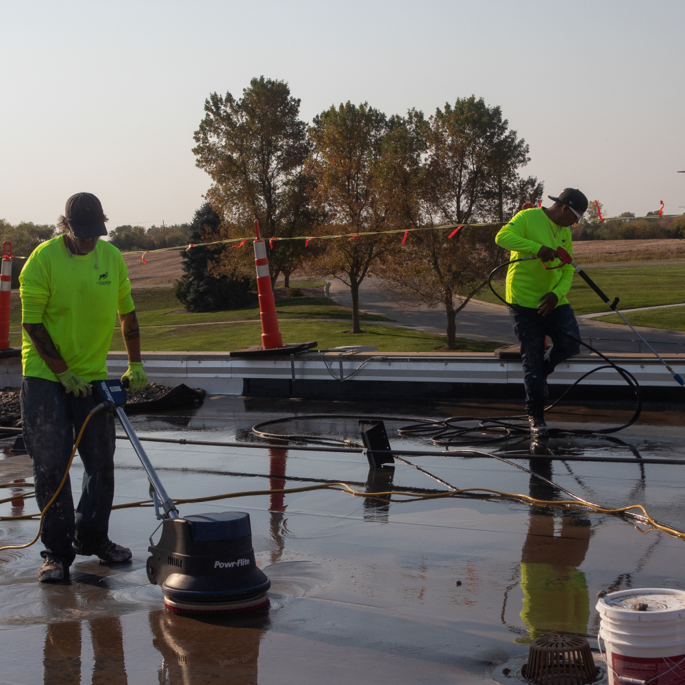 Experienced roofers performing maintenance on a commercial roof in Omaha