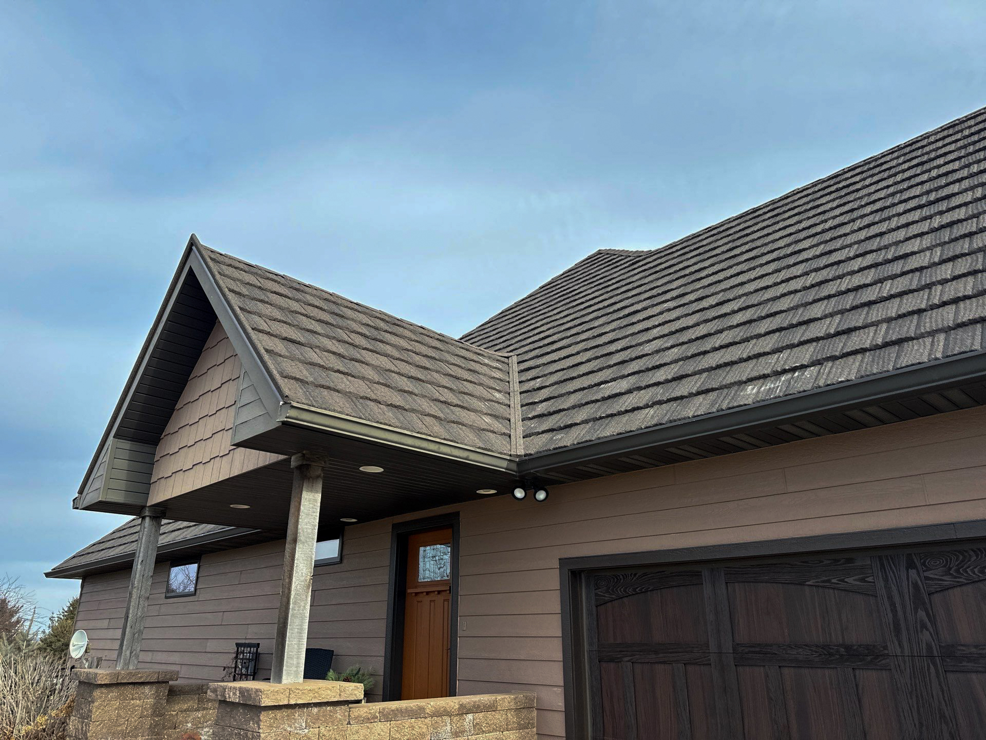 Modern residential house in Omaha with a well-maintained shingle roof.
