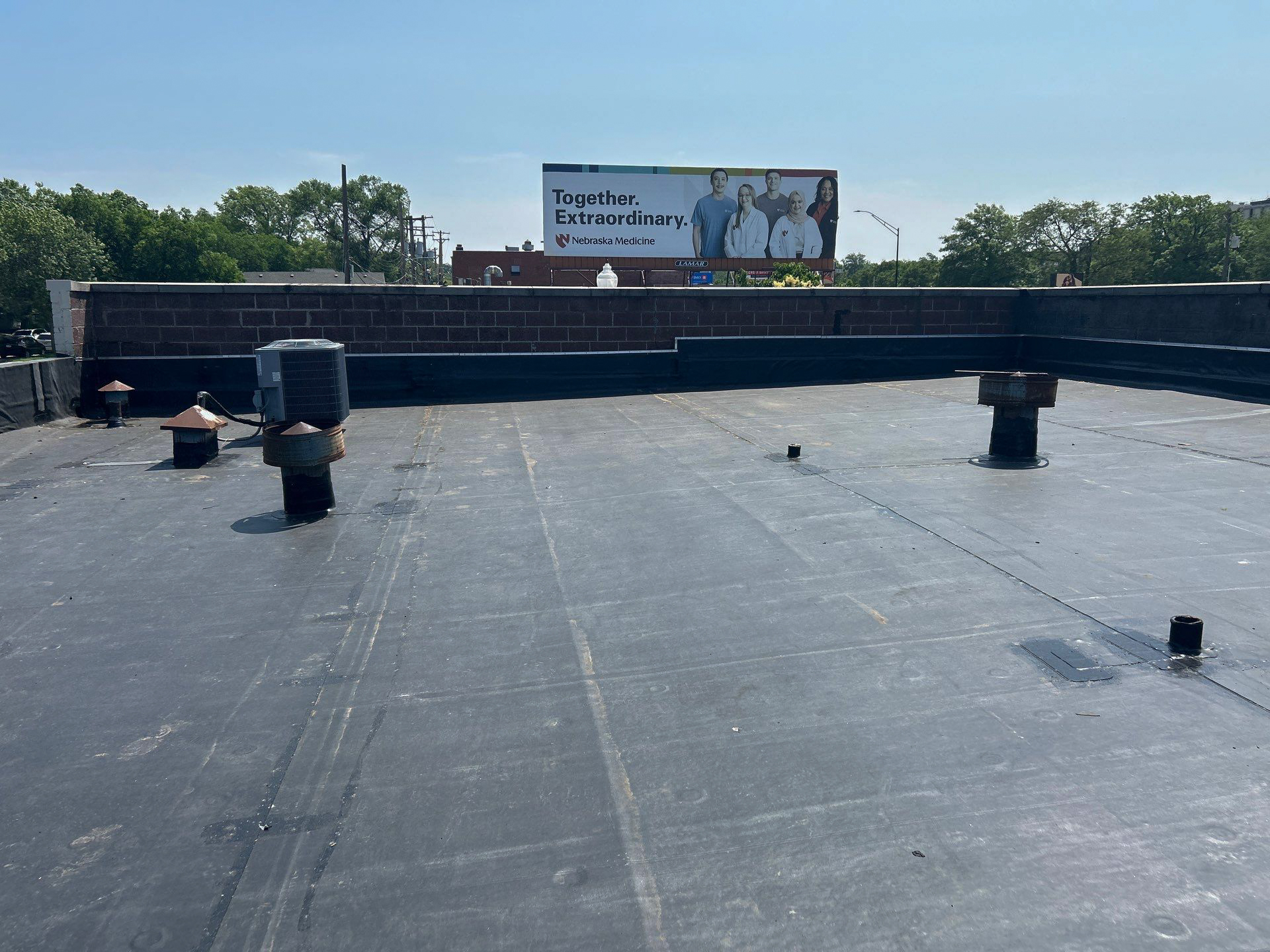 A new black rubber roof replaced by the commerical department at Moose Roofing. A commercial roofing contractor in Omaha, Nebraska