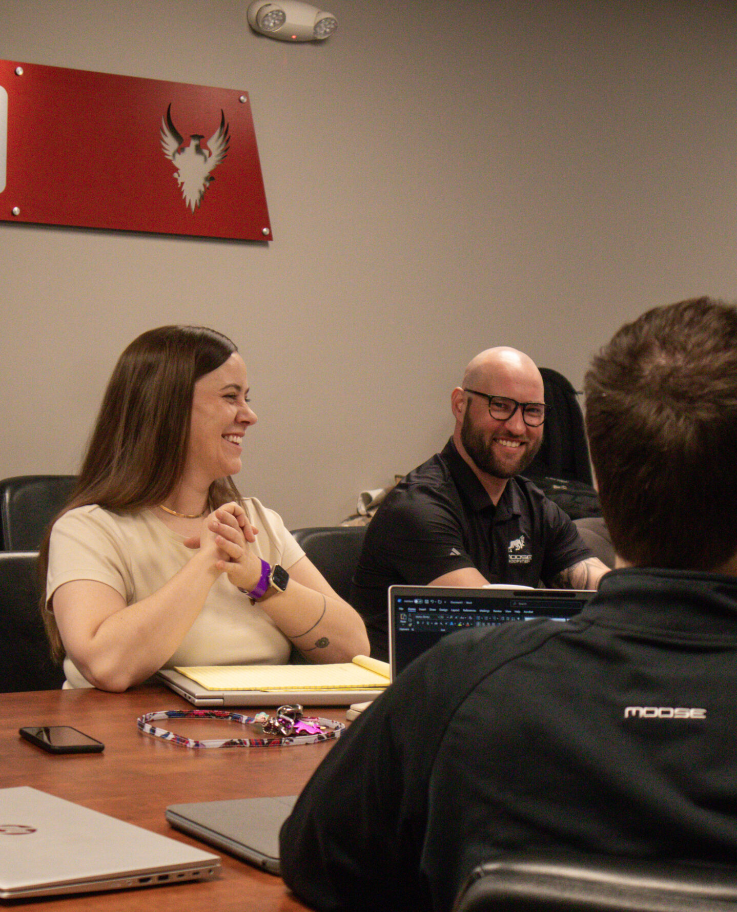 Moose Roofing employees learning and working together