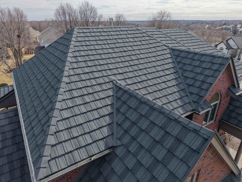 A drone shot of a residential home replaced with stone-coated steel by Moose Roofing in Omaha, Nebraska