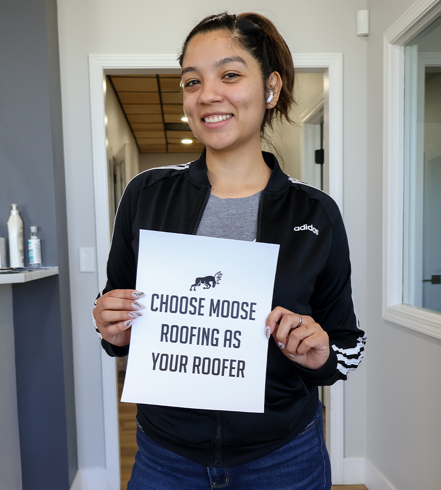 Alley Diaz holding a sign for a video