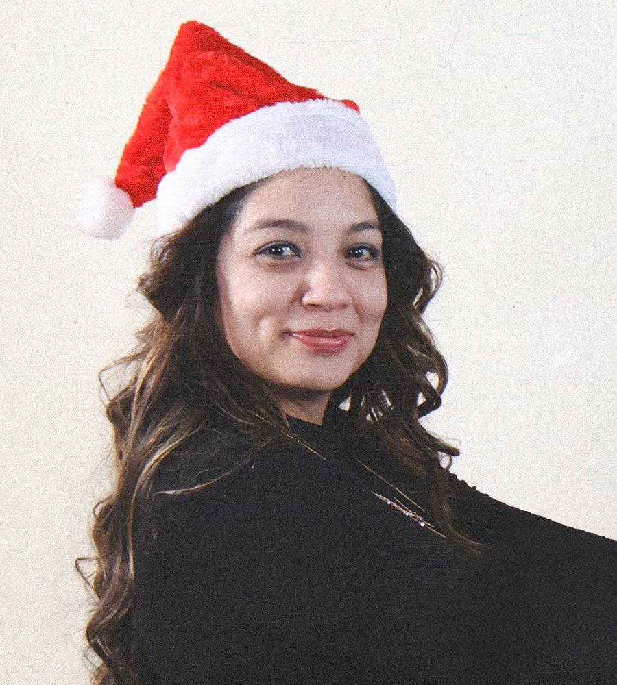 Alley Diaz wearing a santa hat for a holiday picture
