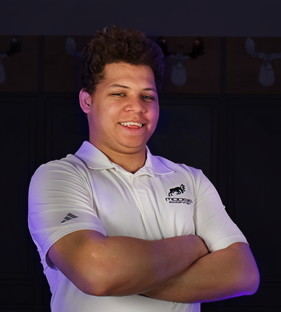 seth goodman wearing a moose roofing branded polo shirt in Omaha, Ne