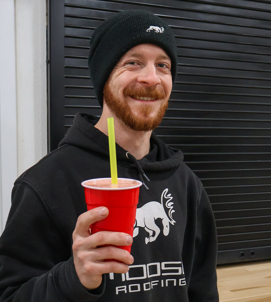 Mark Powell smiling with a smoothie