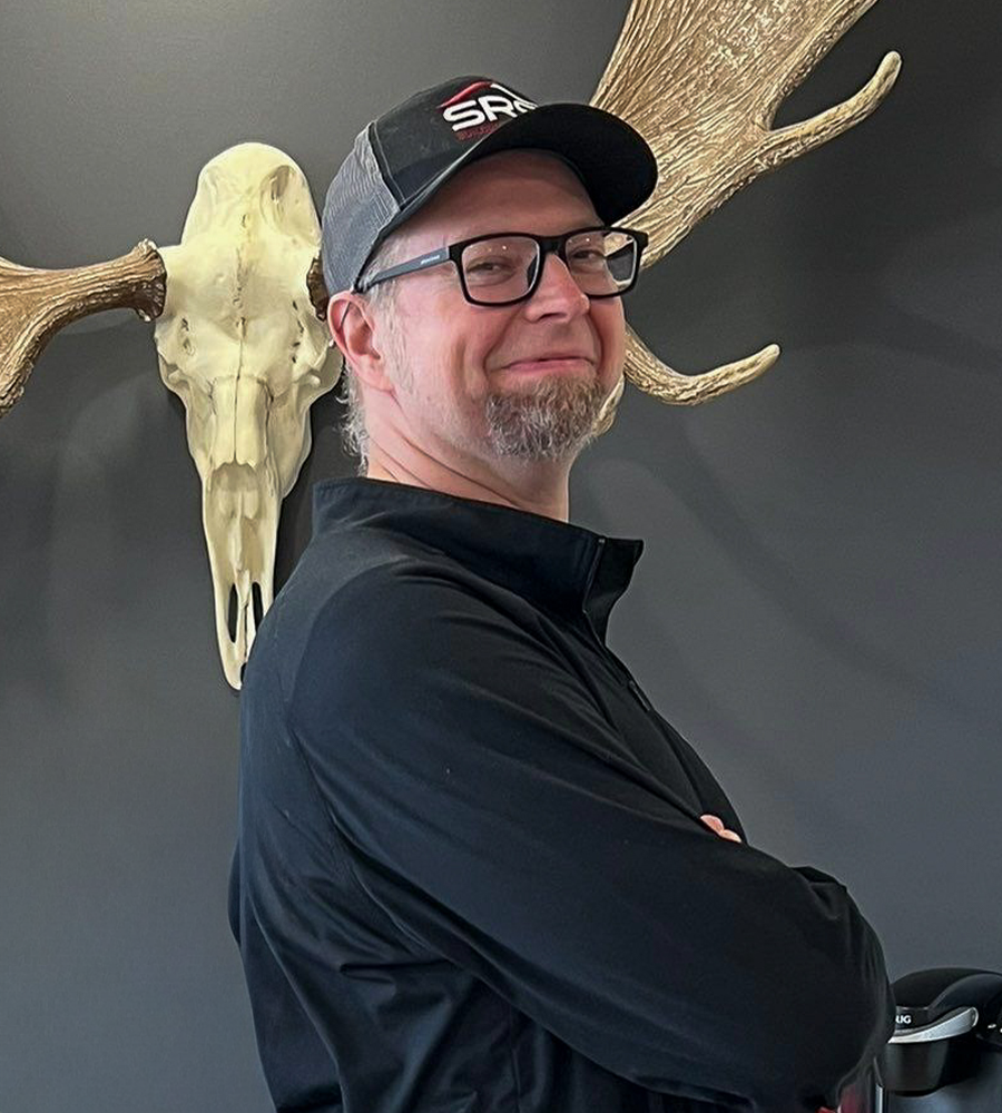 Topher Greene posing for a social media post