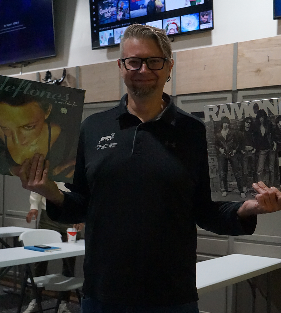 Topher Greene holding vinyls for his birthday