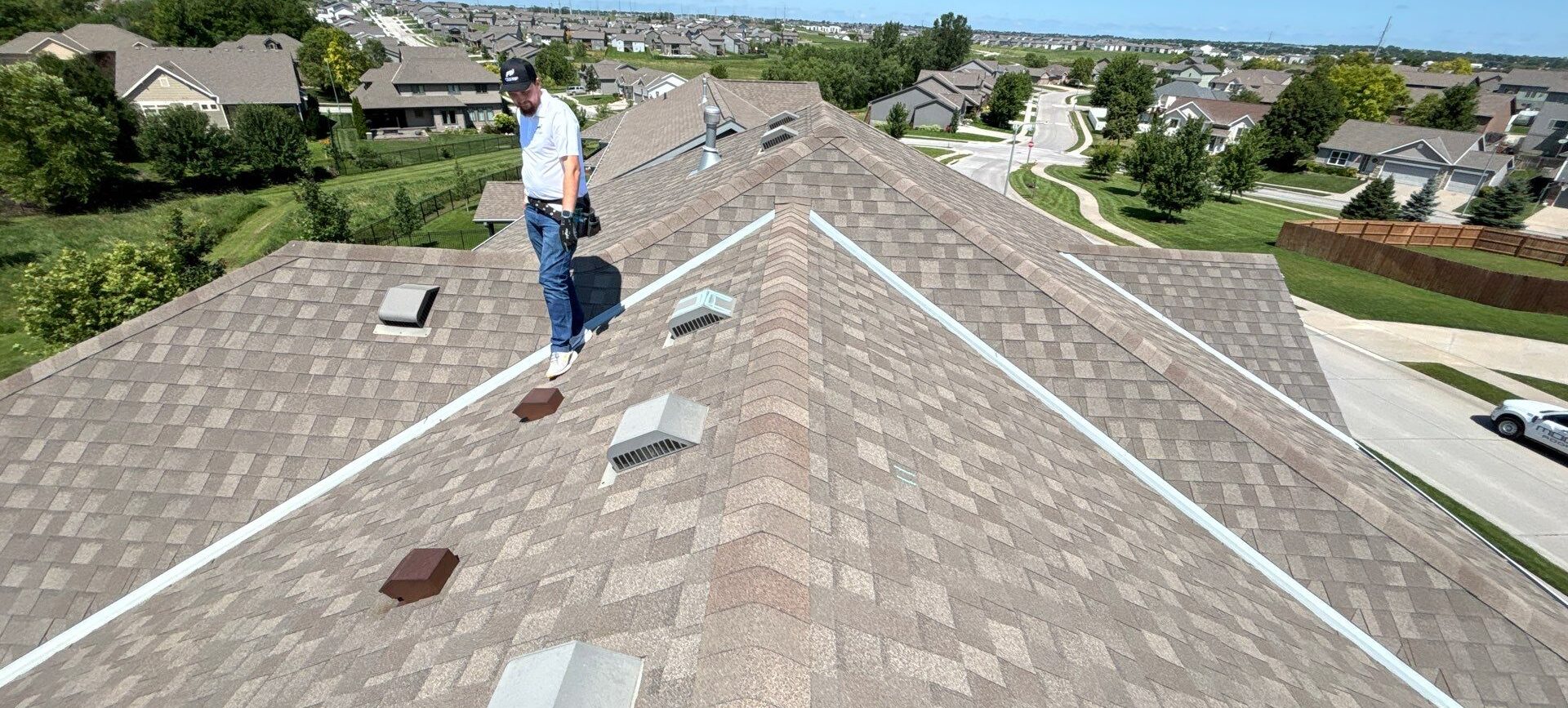 Moose Roofing team providing roofing and attic ventilation services