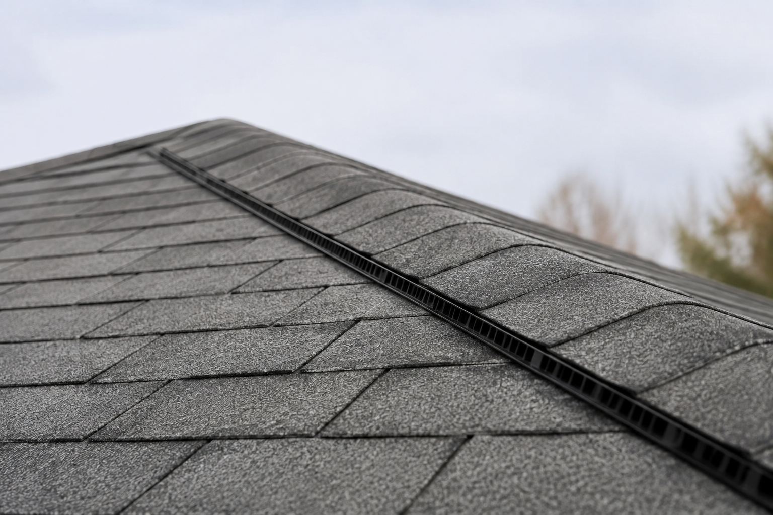 Ridge vent installed along a shingle roof peak