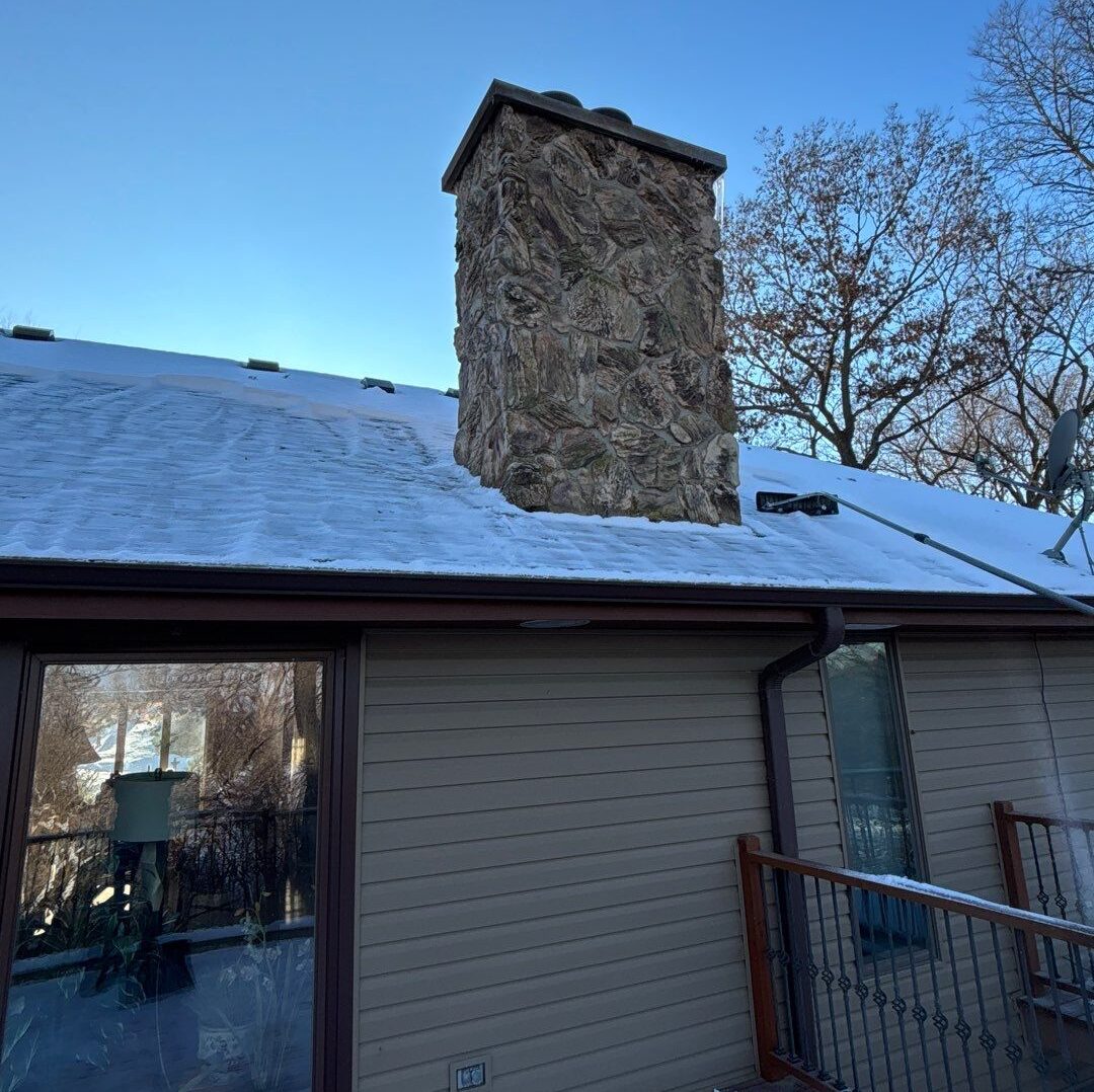 Snow accumulation on a residential roof in Omaha Nebraska