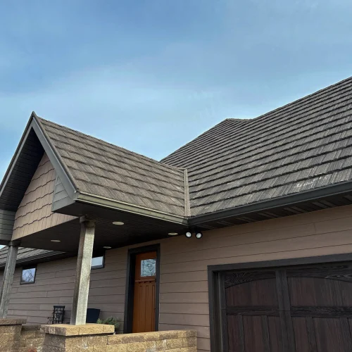 Modern residential house in Omaha with a well-maintained shingle roof.