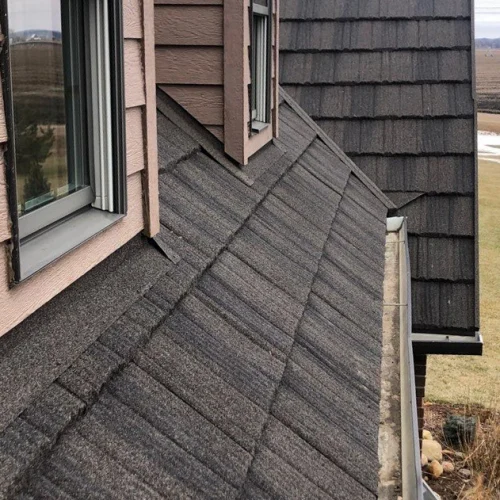 Newly installed grey shingles on a residential roof in Omaha.
