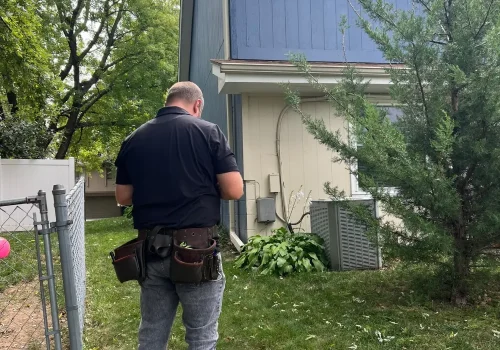 Certified roofing contractor performing a roof inspection in Omaha